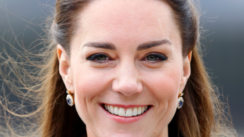 Kate Middleton smiles for a photo. 