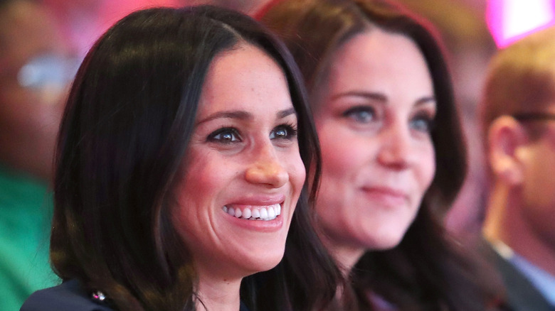Meghan Markle & Kate Middleton sitting together