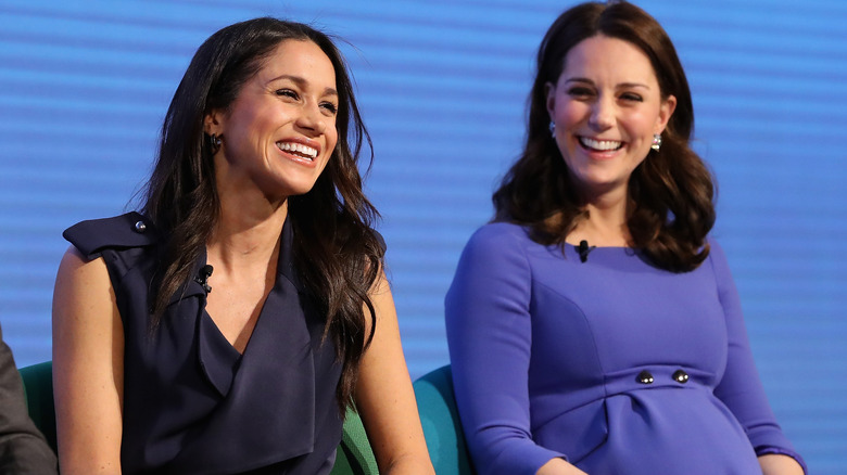Meghan, Duchess of Sussex and Princess Catherine laughing together