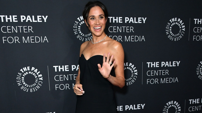 Meghan Markle waving at the camera