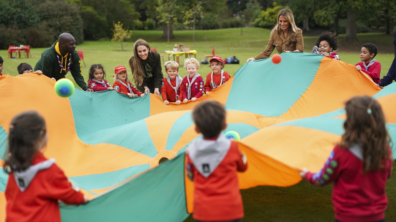 Catherine, Princess of Wales and U.S. first lady Melania Trump interact with Scouts