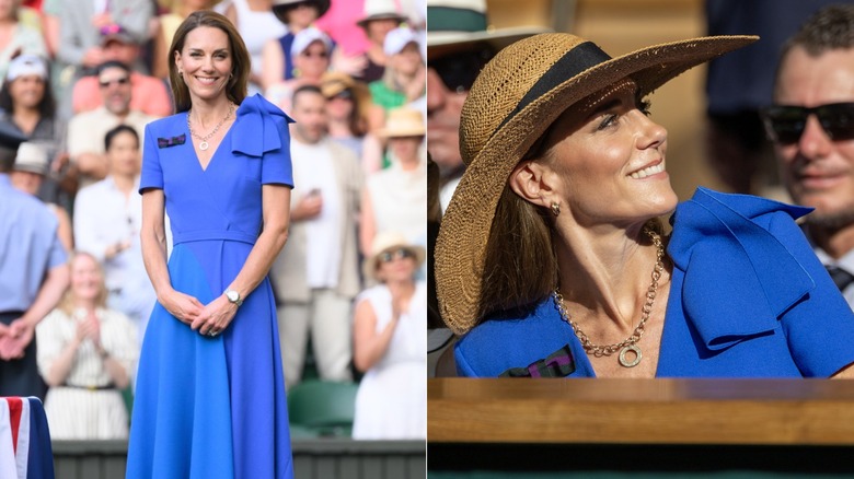 Kate Middleton smiles with her hands held in front of her on a tennis court in front of a crowd.