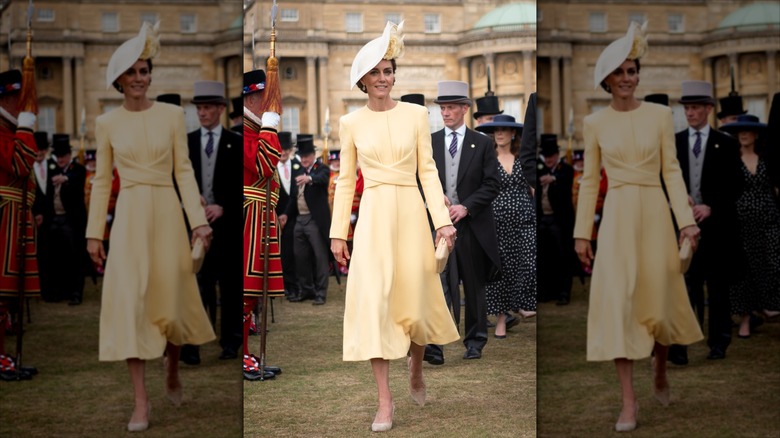 Kate Middleton walking in a crowd.
