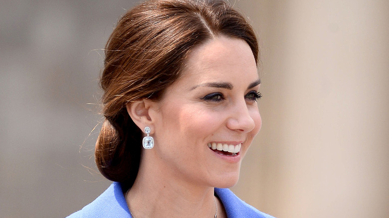 Kate Middleton smiling in blue 