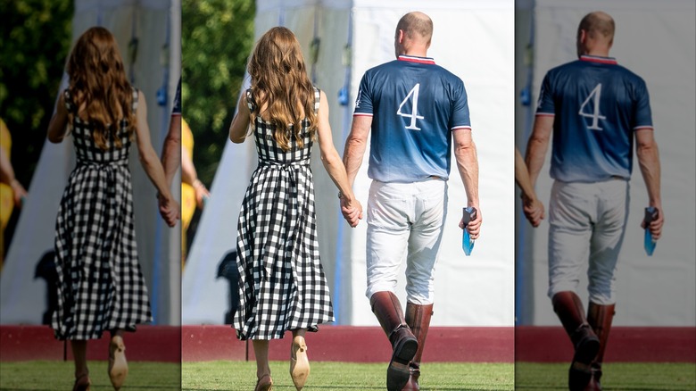 Prince William and Kate Middleton holding hands rear view