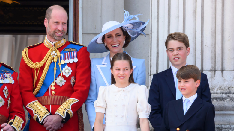 Prince William, Kate Middleton, Princess Charlotte, Prince George, and Prince Louis pose on a balcony together