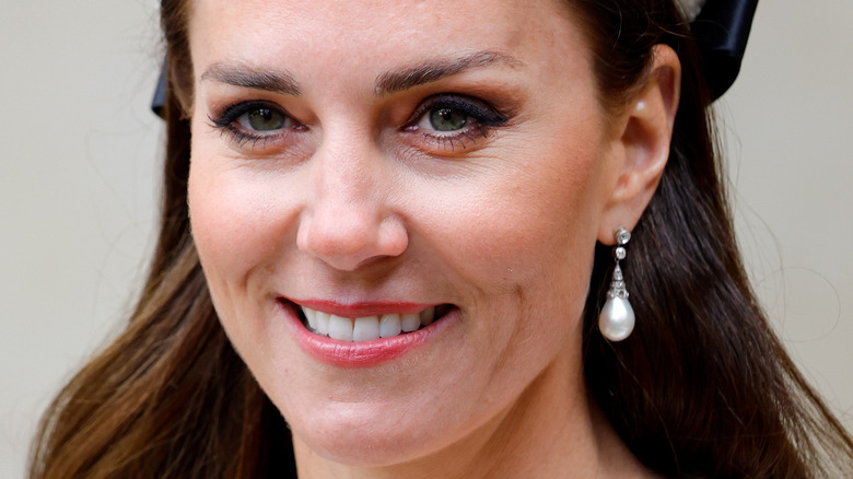 Kate Middleton wearing a white headpiece at Anzac Day