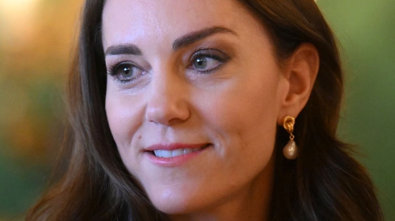 Kate Middleton smiling to side