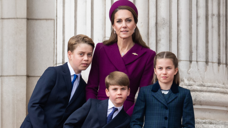 Princess Catherine on the palace balcony with Prince George, Prince Louis, and Princess Charlotte