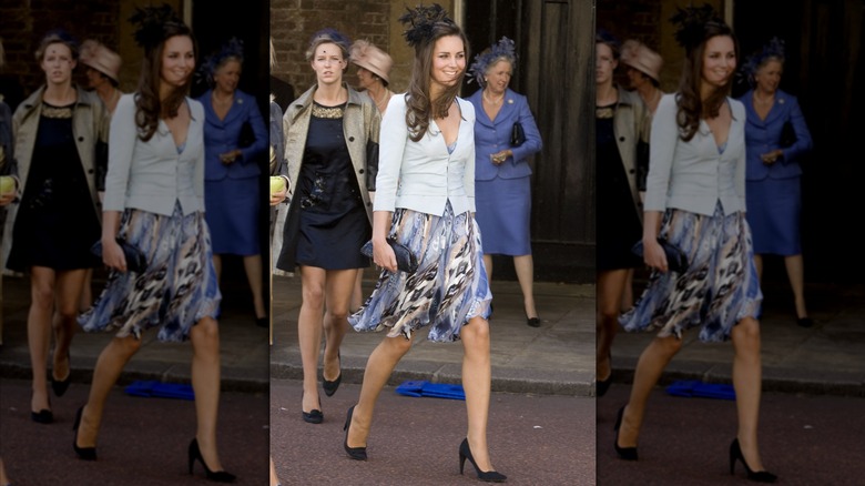 Princess Catherine walking in a patterned dress and pale blue coat.