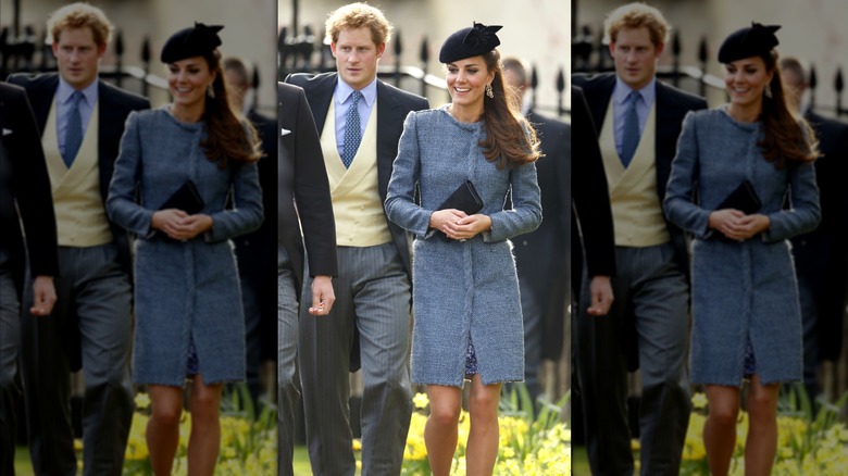 Princess Catherine wearing a blue tweed coat and walking in front of Prince Harry.