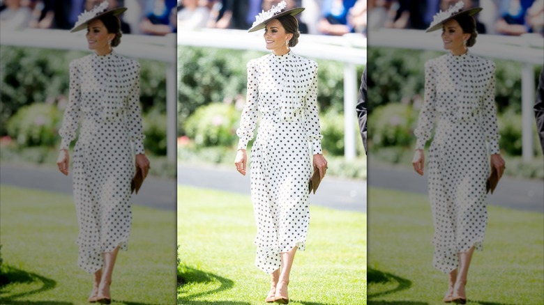 Princess Catherine smiling at the 2022 Royal Ascot in white dress with brown polka dots and wide brim hat