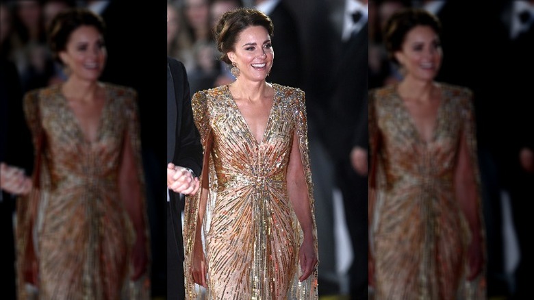 Kate Middleton smiling in gold dress