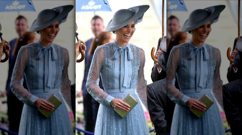 Kate Middleton laughing in blue dress