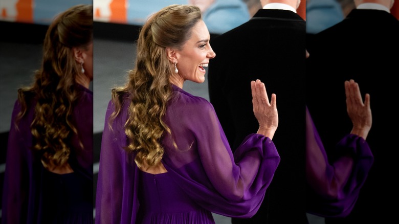 Kate Middleton smiling and waving with a purple dress and no nail polish