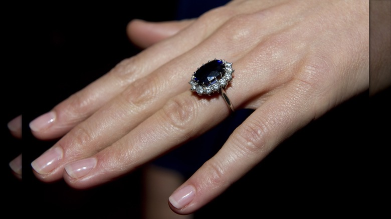 Close-up of Kate Middleton's engagement ring and bare nails