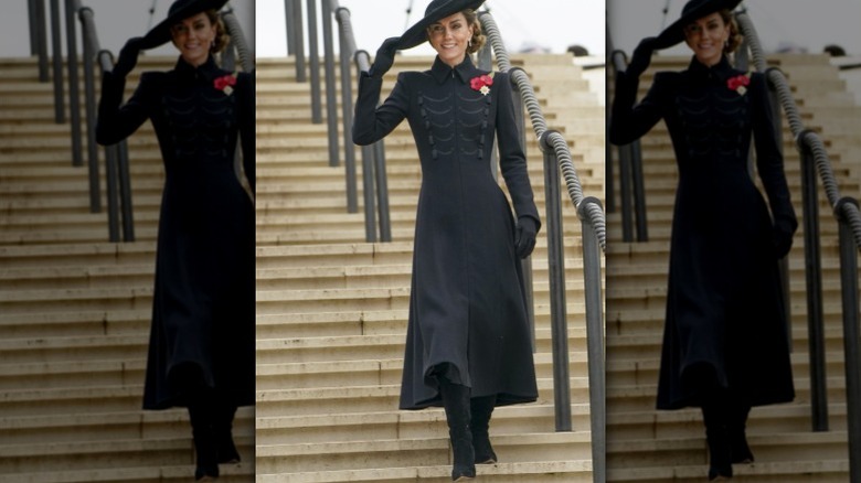 Kate Middleton walking down stairs wearing black outfit