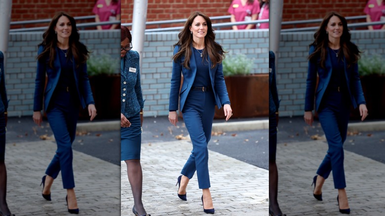 Princess Catherine walking outside of a hospital surgery center opening wearing a monochrome blue pantsuit