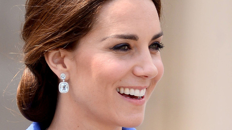 Kate Middleton smiling in diamond earings