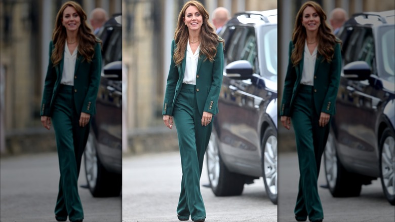 Kate Middleton walking, wearing green pantsuit