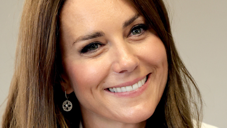 Kate Middleton smiling with her head tilted