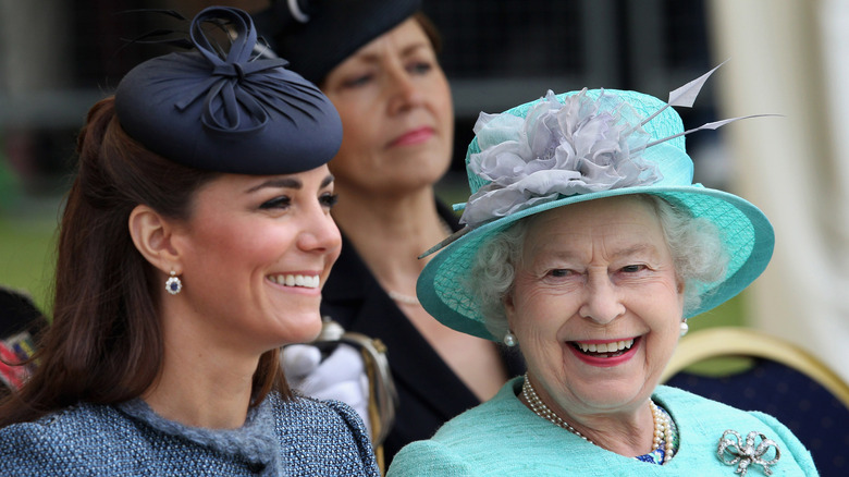 Kate Middleton smiling with Queen Elizabeth II