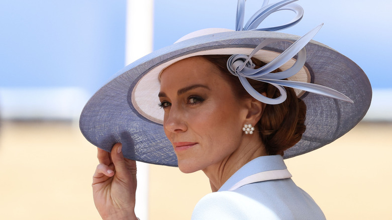 Kate Middleton tipping her hat
