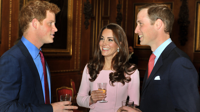 Prince Harry, Kate Middleton, and Prince William in conversation
