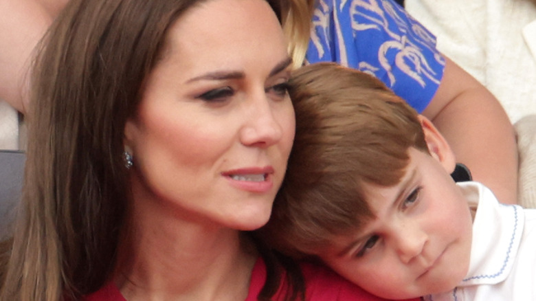 Prince Louis hugs his mother Kate Middleton. 