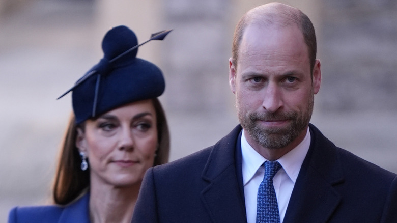 Prince William walking in front of Kate Middleton