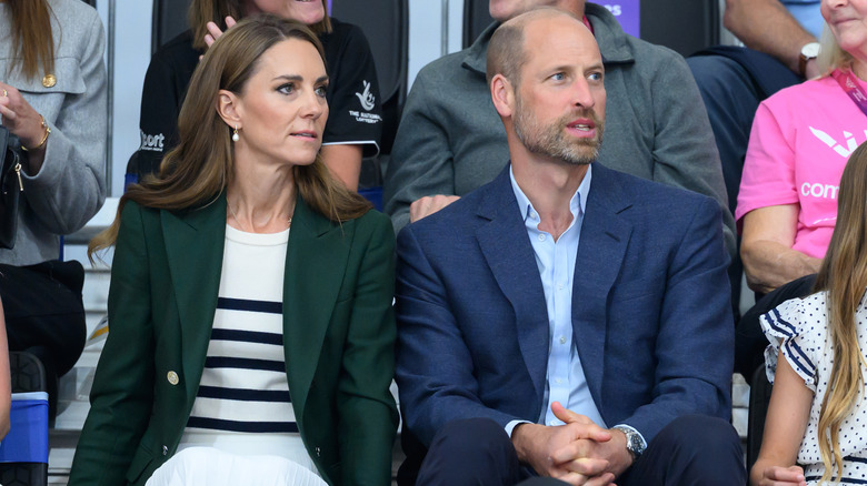 Princess Catherine and Prince William sitting next to each other at an event