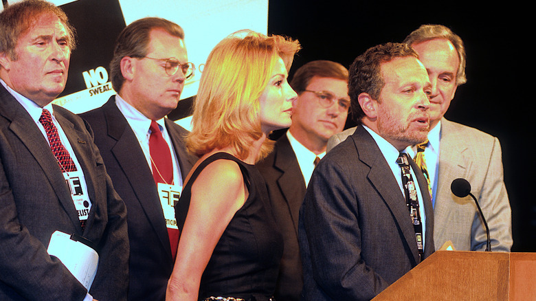 Kathy Lee Gifford stands next to Secretary of Labor Robert Reich