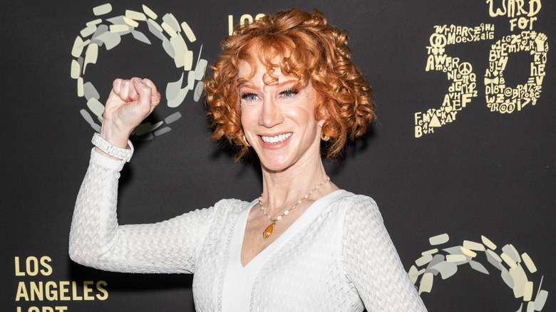 Kathy Griffin smiling and raising her fist