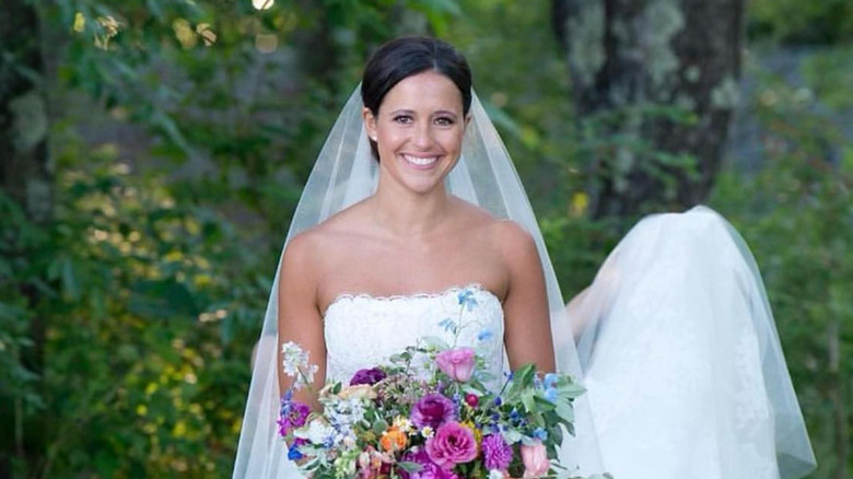 Elinor Monahan smiles in her wedding dress