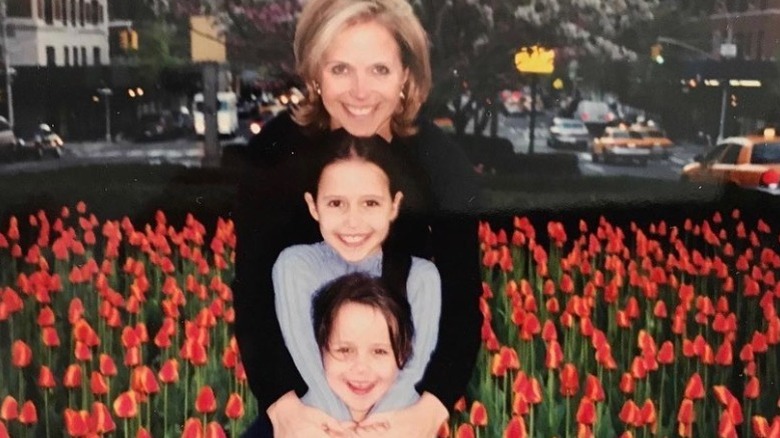 Katie Couric smiling her young daughters