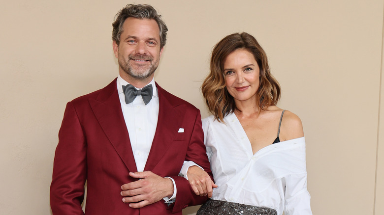 Joshua Jackson and Katie Holmes pose for a photo with their arms linked