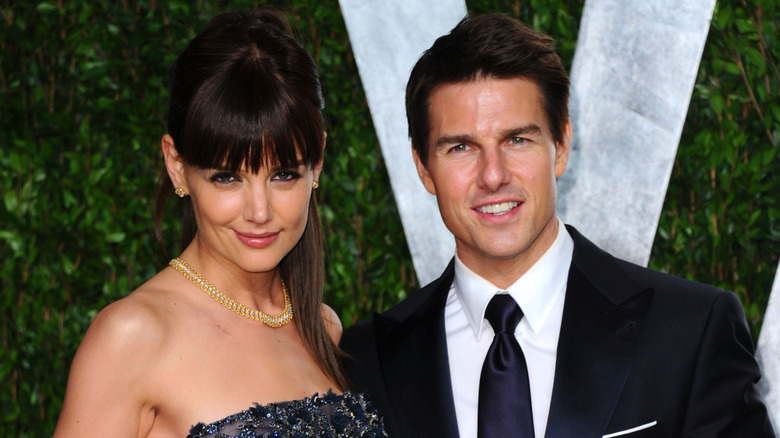 Katie Holmes posing with Tom Cruise