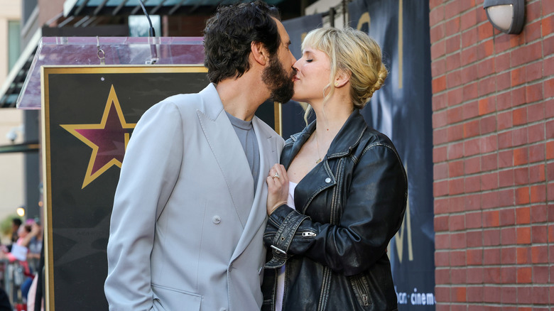 Josh Groban and Natalie McQueen kissing.
