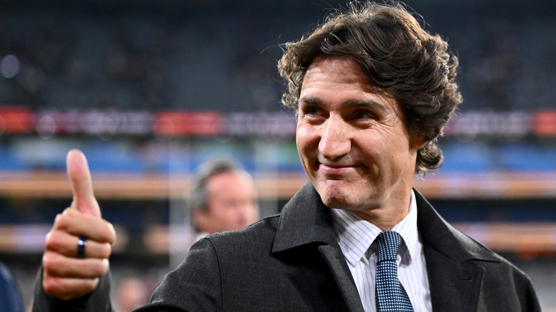 Justin Trudeau giving a thumbs up at a cricket match in 2026