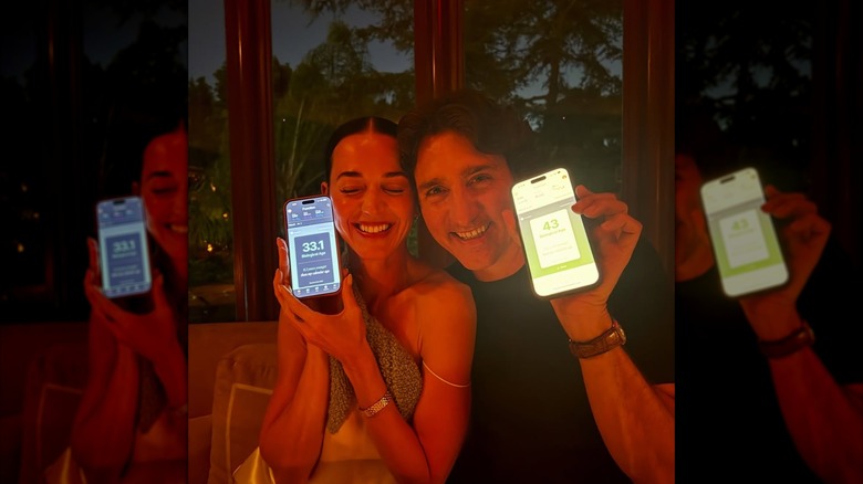Katy Perry and Justin Trudeau holding cell phones