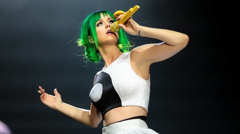 Katy Perry on stage singing during the Prismatic tour