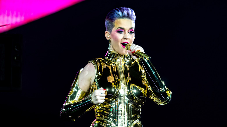 Katy Perry singing on the Witness tour & Katy Perry posing on the red carpet for the Billboard Music Awards in 2012