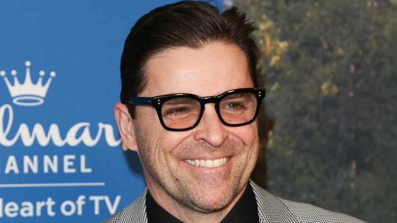 A close-up of a smiling Kavan Smith at a 2026 