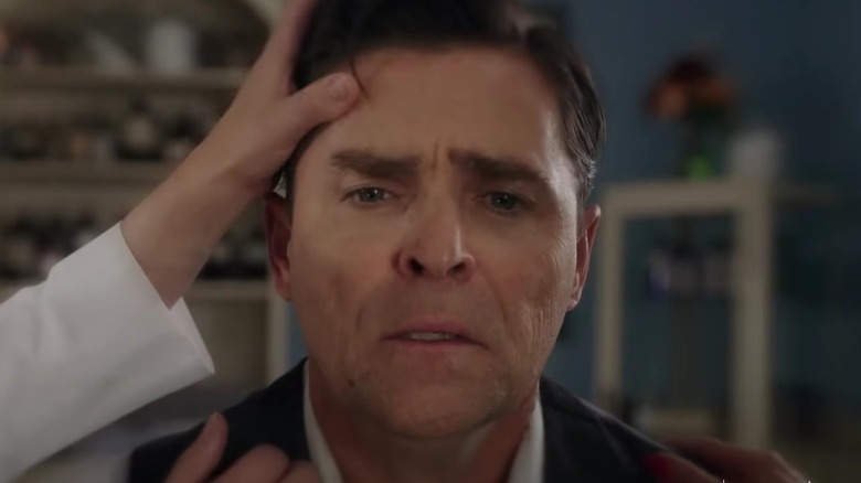 A blurry close-up of Kavan Smith as Lee Coulter having a panic attack on "When Calls The Heart"