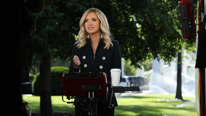 Kayleigh McEnany talking to the press in a black jacket