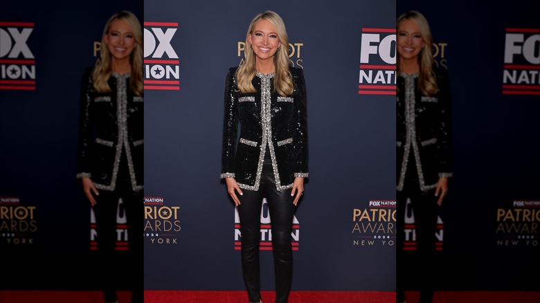 Kayleigh McEnany posing on the red carpet in a black sparkly jacket