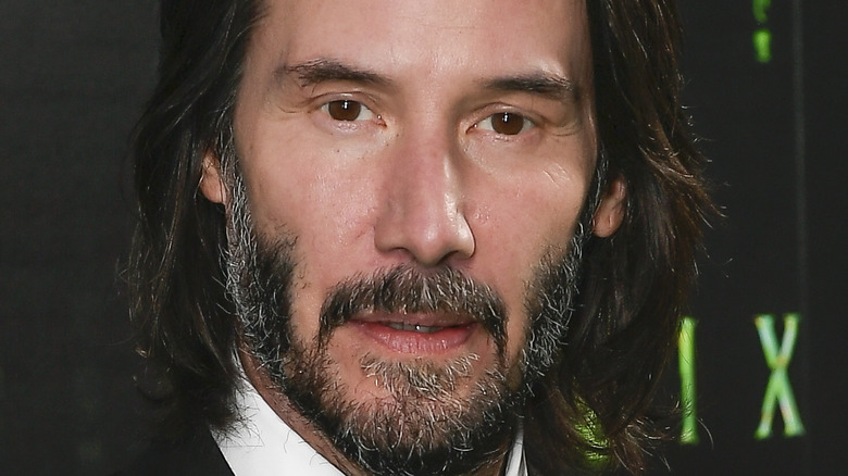 Keanu Reeves posing on the red carpet