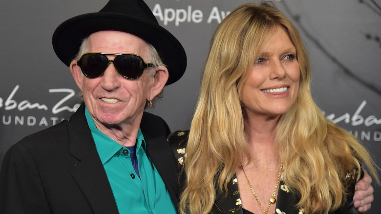 Keith Richards and Patti Hansen smile side by side
