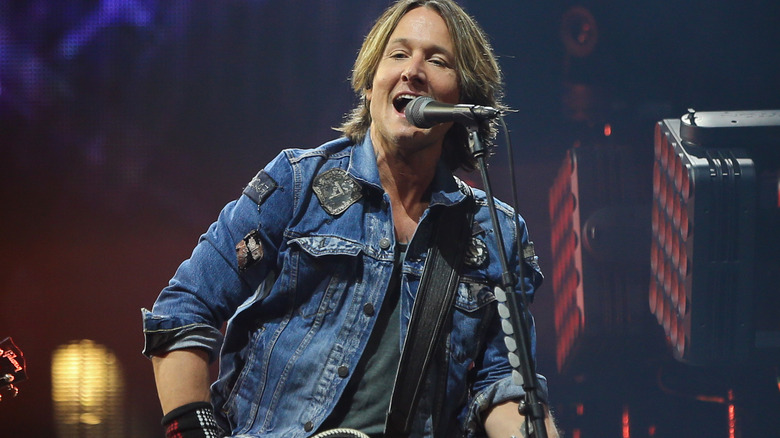 Keith Urban performing at Barclay's Center