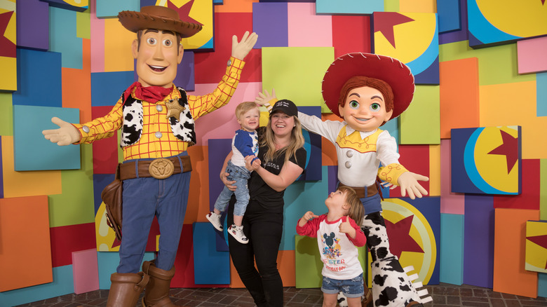 Kelly Clarkson and her children, Remington Alexander and River Rose, visit with Pixar pals Woody and Jessie, 2018